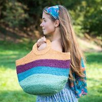 Natural jute bag with round handles and bold stripes