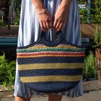 Navy jute bag with round handles and golden stripes
